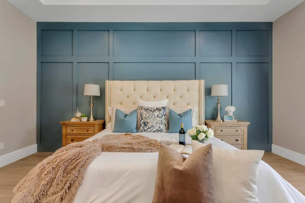 Blue accent wall with decorative trim panels by an interior painter in Carlsbad, CA.
