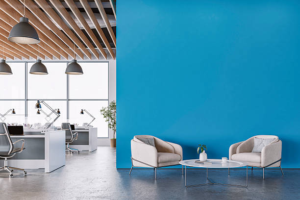 Office interior with vibrant blue walls and professional finishes by a commercial painter in Chula Vista, CA
