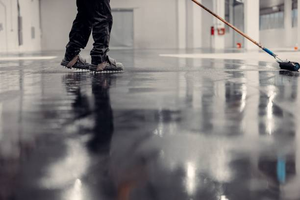 Professional coating application on a warehouse floor